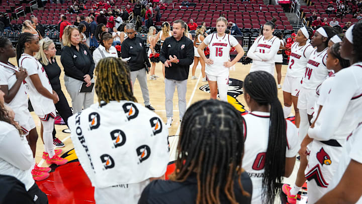 Louisville Cardinals head coach Jeff Walz talks to the Cards after their win over Southern Indiana University Friday night at the KFC Yum! Center in Louisville, Ky. Nov. 8, 2024. Louisville Cardinals head coach Jeff Walz talks to the Cards after their win over Southern Indiana University Friday night at the KFC Yum! Center in Louisville, Ky. Nov. 8, 2024.