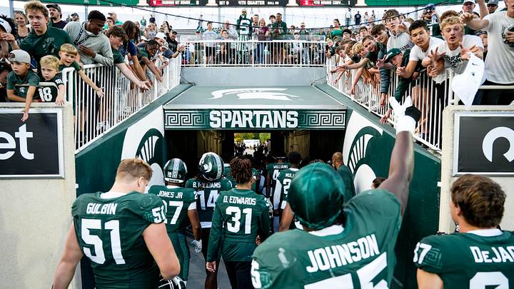 Sep 13, 2025; East Lansing, Michigan, USA; Michigan State offensive lineman Rakeem Johnson (55) throws a towel to fans after a victory over Youngstown State at Spartan Stadium. Mandatory Credit: Brendan Mullin-Imagn Images Sep 13, 2025; East Lansing, Michigan, USA; Michigan State offensive lineman Rakeem Johnson (55) throws a towel to fans after a victory over Youngstown State at Spartan Stadium. Mandatory Credit: Brendan Mullin-Imagn Images