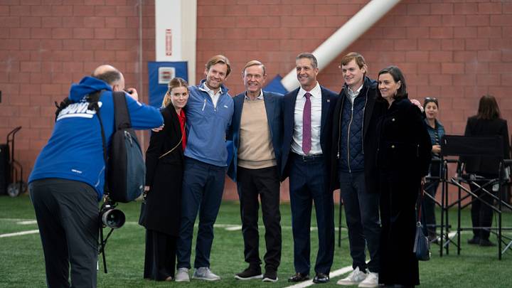 New Head Coach John Harbaugh, right of center, takes a photo with Chris Mara, Actress Kate Mara, and family, during a press conference introducing Harbaugh at the Quest Diagnostics Training Center in East Rutherford on Tuesday, Jan. 20, 2025.