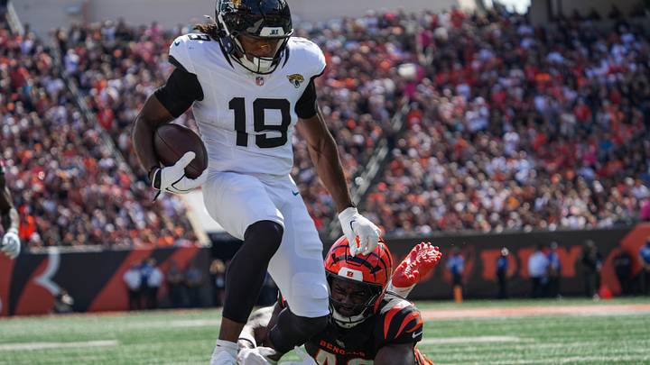 Bengals Oren Burks (42) takes down Jaguars Josh Cameron (19) during their game against the Jaguars at Paycor Stadium on Sunday October 4, 2026. The Jaguars were up 13-3 at halftime. Bengals Oren Burks (42) takes down Jaguars Josh Cameron (19) during their game against the Jaguars at Paycor Stadium on Sunday October 4, 2026. The Jaguars were up 13-3 at halftime.