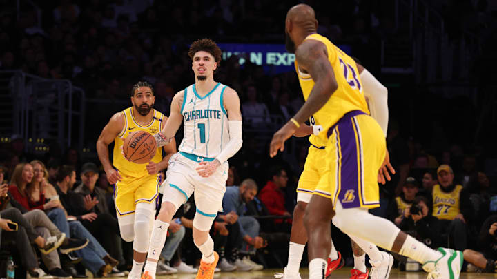 Charlotte Hornets guard LaMelo Ball dribbles against Los Angeles Lakers forward LeBron James during the third quarter at Crypto.com Arena.