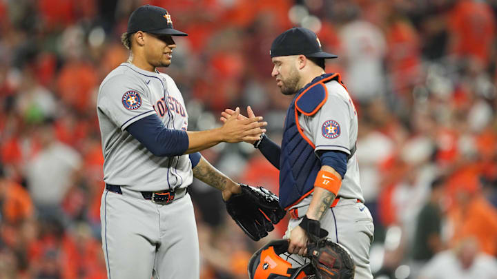 Aug 23, 2025; Baltimore, Maryland, USA; Houston Astros pitcher Bryan Abreu (52) greeted by catcher Victor Caratini (17) after pitching the ninth inning to earn a save against the Baltimore Orioles at Oriole Park at Camden Yards. 
