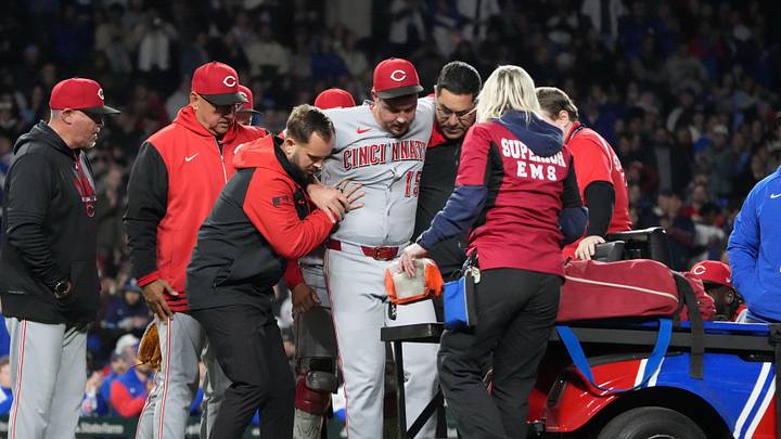 May 5, 2026; Chicago, Illinois, USA; Cincinnati Reds pitcher Emilio Pagan (15) reacts to an injury during the ninth inning against the Chicago Cubs at Wrigley Field. Mandatory Credit: David Banks-Imagn Images