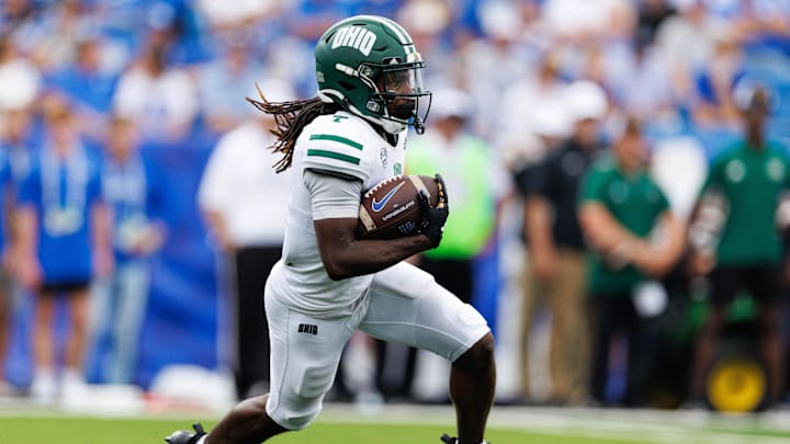 Lexington, Kentucky, USA; Ohio Bobcats wide receiver Chase Hendricks (7) runs the ball during the second quarter against the Kentucky Wildcats at Kroger Field.
