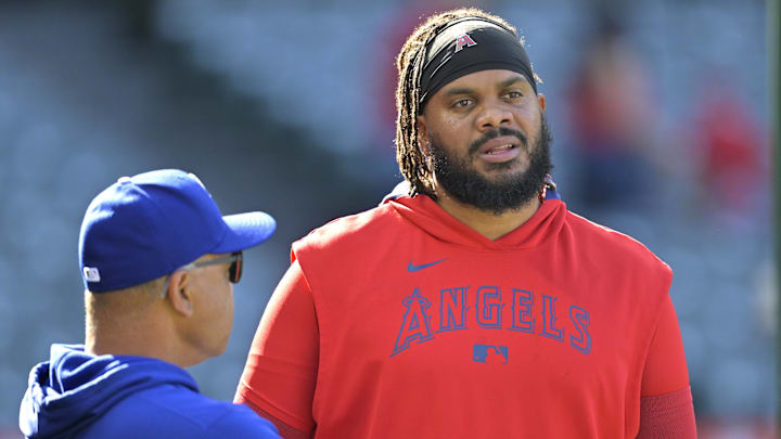 Mar 24, 2025; Anaheim, California, USA;  Los Angeles Dodgers manager Dave Roberts (30) talks with Los Angeles Angels pitcher Kenley Jansen (74) prior to the game at Angel Stadium. Mandatory Credit: Jayne Kamin-Oncea-Imagn Images