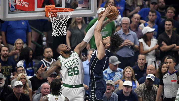 Jun 12, 2024; Dallas, Texas, USA; Dallas Mavericks center Dereck Lively II (2) shoots against Boston Celtics forward Xavier Tillman (26) during the first quarter in game three of the 2024 NBA Finals at American Airlines Center. Mandatory Credit: Jerome Miron-USA TODAY Sports