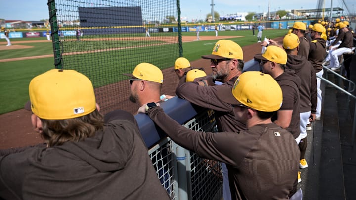 Feb 23, 2026; Peoria, Arizona, USA;  San Diego Padres coaches look on from the dugout during the game against the Milwaukee Brewers at Peoria Sports Complex. Mandatory Credit: Jayne Kamin-Oncea-Imagn Images
