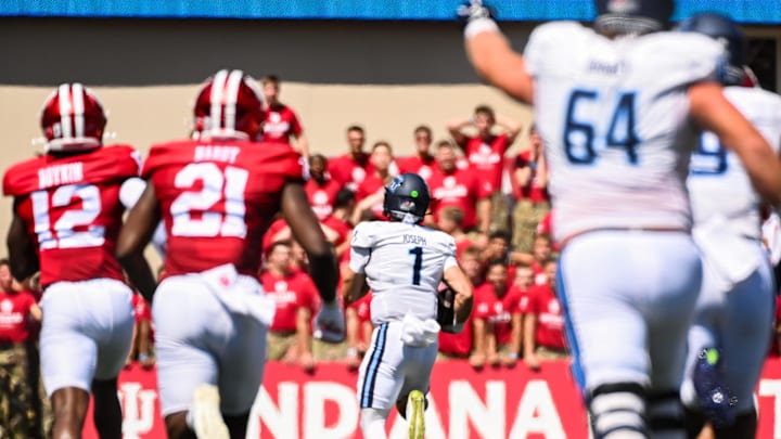 Aug 30, 2025; Bloomington, Indiana, USA; Old Dominion Monarchs quarterback Colton Joseph (1) runs for a touchdown against the Indiana Hoosiers during the first half at Memorial Stadium. Mandatory Credit: Robert Goddin-Imagn Images