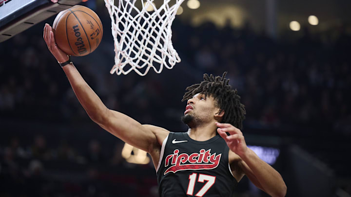 Nov 22, 2023; Portland, Oregon, USA; Portland Trail Blazers guard Shaedon Sharpe (17) grabs a defensive rebound during the first half against the Utah Jazz at Moda Center. Mandatory Credit: Troy Wayrynen-USA TODAY Sports