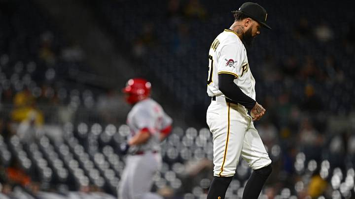 Apr 27, 2026; Pittsburgh, Pennsylvania, USA; Pittsburgh Pirates relief pitcher Dennis Santana (60) waits for St. Louis Cardinals catcher Pedro Pages (43) to run the bases after hitting a solo home run during the ninth inning at PNC Park. Mandatory Credit: David Dermer-Imagn Images