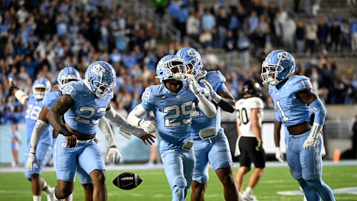 Nov 16, 2024; Chapel Hill, North Carolina, USA; North Carolina Tar Heels defensive back Marcus Allen (29) celebrates after making an interception in the third quarter at Kenan Memorial Stadium. Mandatory Credit: Bob Donnan-Imagn Images Nov 16, 2024; Chapel Hill, North Carolina, USA; North Carolina Tar Heels defensive back Marcus Allen (29) celebrates after making an interception in the third quarter at Kenan Memorial Stadium. Mandatory Credit: Bob Donnan-Imagn Images