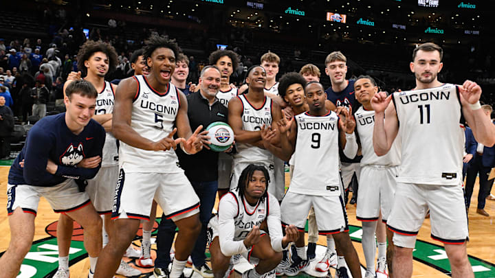Nov 15, 2025; Boston, Massachusetts, USA; The UConn Huskies pose for a photo after a game against the BYU Cougars at TD Garden. Mandatory Credit: Eric Canha-Imagn Images