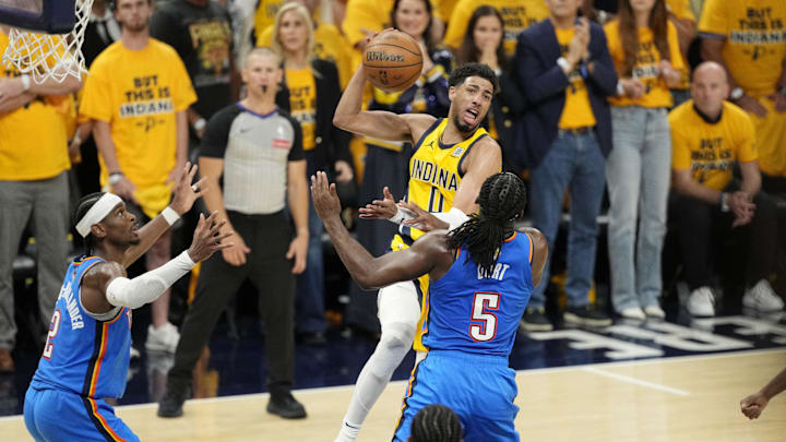 Jun 11, 2025; Indianapolis, Indiana, USA; Indiana Pacers guard Tyrese Haliburton (0) controls the ball against Oklahoma City Thunder guard Luguentz Dort (5) during the second half during game three of the 2025 NBA Finals at Gainbridge Fieldhouse. Mandatory Credit: Kyle Terada-Imagn Images