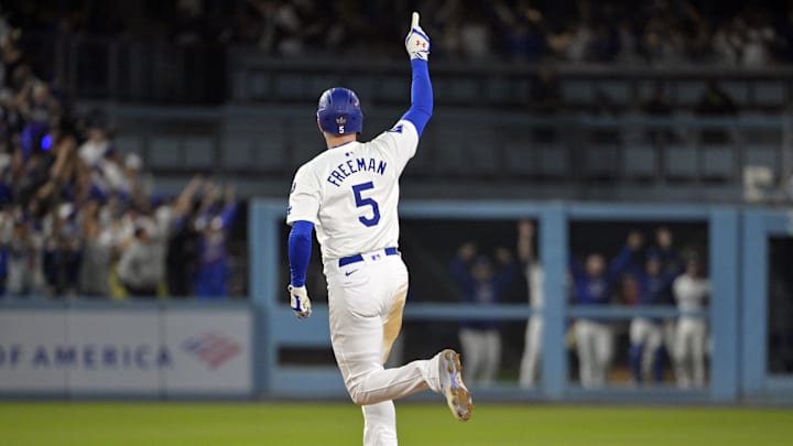 Los Angeles Dodgers first baseman Freddie Freeman (5) runs after hitting a grand slam home run in the tenth inning against the New York Yankees during game one of the 2024 MLB World Series at Dodger Stadium on Oct 25.