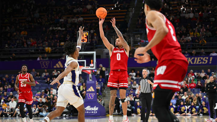 Feb 28, 2026; Seattle, Washington, USA; Wisconsin Badgers guard Braeden Carrington (0) shoots a three point shot against the Washington Huskies during the second half at Alaska Airlines Arena at Hec Edmundson Pavilion. Mandatory Credit: Steven Bisig-Imagn Images Feb 28, 2026; Seattle, Washington, USA; Wisconsin Badgers guard Braeden Carrington (0) shoots a three point shot against the Washington Huskies during the second half at Alaska Airlines Arena at Hec Edmundson Pavilion. Mandatory Credit: Steven Bisig-Imagn Images
