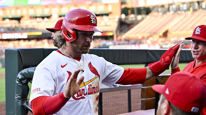 Jul 10, 2025; St. Louis, Missouri, USA;  St. Louis Cardinals second baseman Brendan Donovan (33) is congratulated by teammates after scoring against the Washington Nationals during the third inning at Busch Stadium. Mandatory Credit: Jeff Curry-Imagn Images