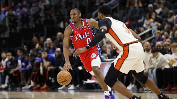 Feb 7, 2025; Detroit, Michigan, USA;  Philadelphia 76ers guard Tyrese Maxey (0) dribbles defended by Detroit Pistons guard Malik Beasley (5) in the first half at Little Caesars Arena. Mandatory Credit: Rick Osentoski-Imagn Images