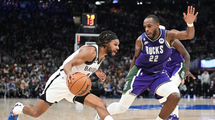 Mar 9, 2023; Milwaukee, Wisconsin, USA; Brooklyn Nets guard Patty Mills (8) drives to the basket against Milwaukee Bucks forward Khris Middleton (22) in the second half at Fiserv Forum. Mandatory Credit: Michael McLoone-USA TODAY Sports