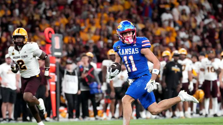 Sep 19, 2026; London, ENG; Kansas Jayhawks wide receiver Tate Nagy (11) runs with the ball for a touchdown against the Arizona State Sun Devils during the second half at Wembley Stadium. Mandatory Credit: Peter van den Berg-Imagn Images Sep 19, 2026; London, ENG; Kansas Jayhawks wide receiver Tate Nagy (11) runs with the ball for a touchdown against the Arizona State Sun Devils during the second half at Wembley Stadium. Mandatory Credit: Peter van den Berg-Imagn Images