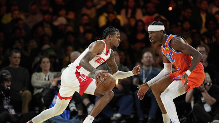 Dec 14, 2024; Las Vegas, Nevada, USA; Houston Rockets guard Jalen Green (4) controls the ball against Oklahoma City Thunder guard Shai Gilgeous-Alexander (2) during the second quarter in a semifinal of the 2024 Emirates NBA Cup at T-Mobile Arena. Mandatory Credit: Kyle Terada-Imagn Images