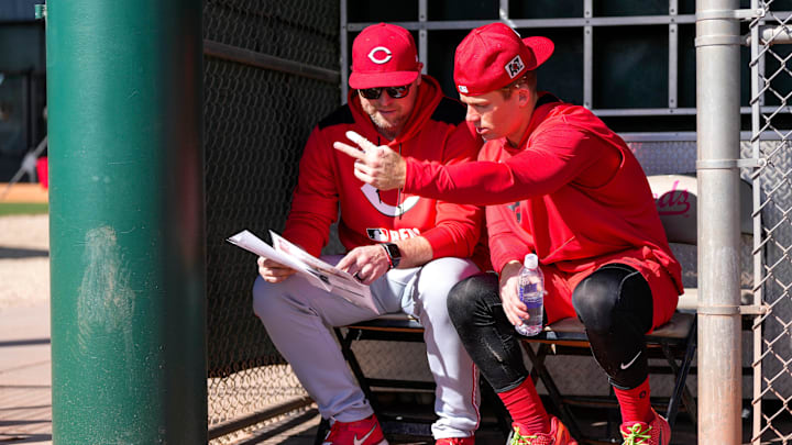 Cincinnati Reds shortstop Matt McLain (9) checks notes at the Cincinnati Reds Player Development Complex in Goodyear, Ariz., on Friday, Feb. 14, 2025.