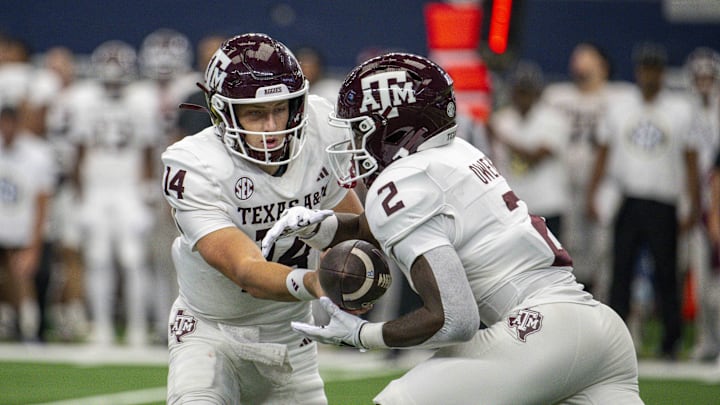 Sep 30, 2023; Arlington, Texas, USA; Texas A&M Aggies quarterback Max Johnson (14) and running