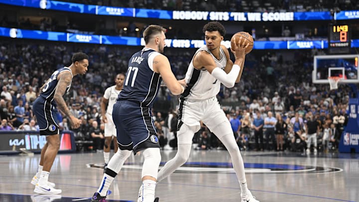 Oct 24, 2024; Dallas, Texas, USA; Dallas Mavericks guard Luka Doncic (77) and San Antonio Spurs center Victor Wembanyama (1) in action during the game between the Dallas Mavericks and the San Antonio Spurs at the American Airlines Center. Mandatory Credit: Jerome Miron-Imagn Images Oct 24, 2024; Dallas, Texas, USA; Dallas Mavericks guard Luka Doncic (77) and San Antonio Spurs center Victor Wembanyama (1) in action during the game between the Dallas Mavericks and the San Antonio Spurs at the American Airlines Center. Mandatory Credit: Jerome Miron-Imagn Images