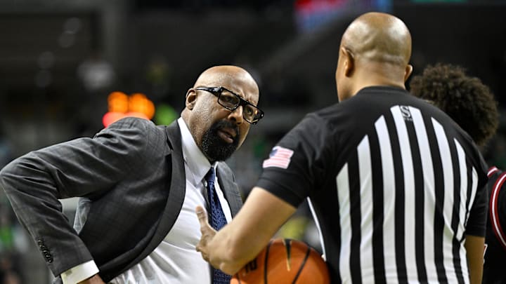 Indiana Hoosiers head coach Mike Woodson questions the referee regarding a call during the first half against the Oregon Ducks at Matthew Knight Arena.