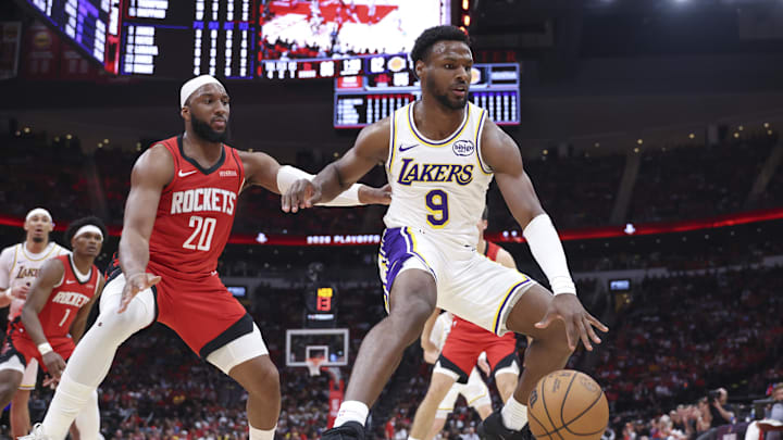 Apr 26, 2026; Houston, Texas, USA; Los Angeles Lakers guard Bronny James (9) loses control of the ball as Houston Rockets guard Josh Okogie (20) defends during the third quarter during game four of the first round of the 2026 NBA Playoffs at Toyota Center. Mandatory Credit: Troy Taormina-Imagn Images