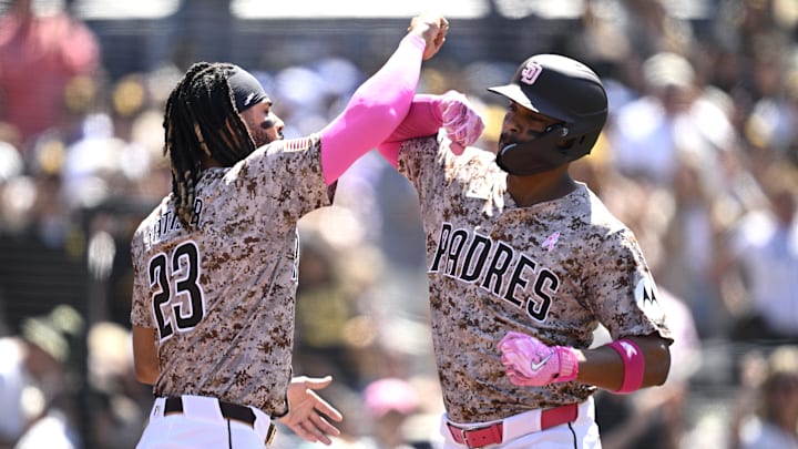 May 12, 2024; San Diego, California, USA; San Diego Padres second baseman Xander Bogaerts greets teammate Fernando Tatis Jr. after hitting a solo home run against the Los Angeles Dodgers.