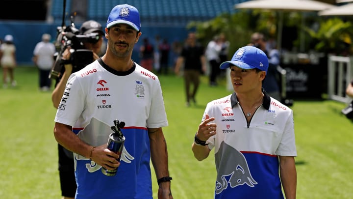 May 5, 2024; Miami Gardens, Florida, USA; RB driver Daniel Ricciardo (3) and RB racing driver Yuki Tsunoda (22) walk in the F1 Village before the F1 Miami Grand Prix at Miami International Autodrome. Mandatory Credit: Peter Casey-USA TODAY Sports