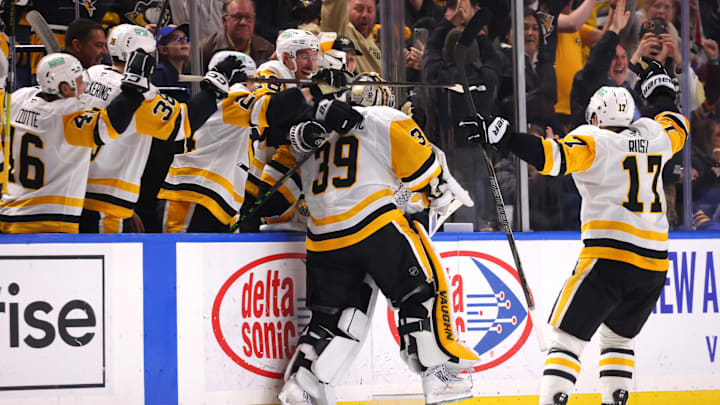 Jan 17, 2025; Buffalo, New York, USA;  Pittsburgh Penguins goaltender Alex Nedeljkovic (39) celebrates his goal with teammates during the third period against the Buffalo Sabres at KeyBank Center. Mandatory Credit: Timothy T. Ludwig-Imagn Images