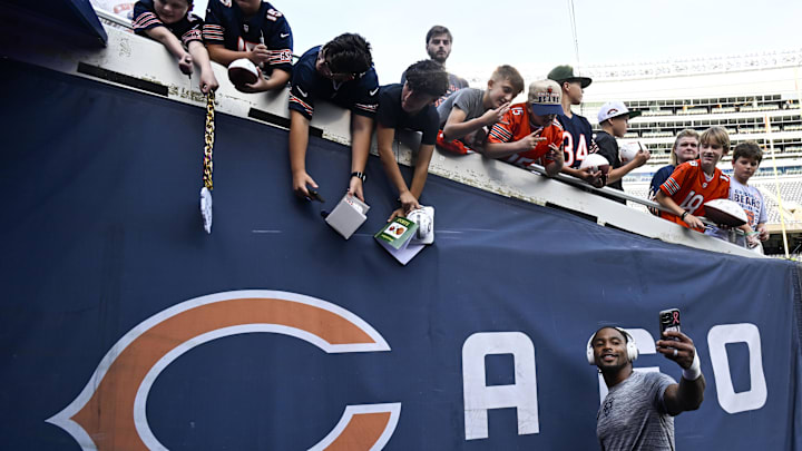 Chicago Bears safety Jonathan Owens (36) poses for a selfie with fans before the preseason game at Soldier Field Chicago Bears safety Jonathan Owens (36) poses for a selfie with fans before the preseason game at Soldier Field
