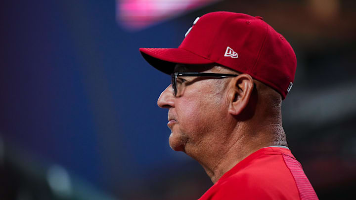 Apr 14, 2026; Cincinnati, Ohio, USA;  Cincinnati Reds manager Terry Francona (77) watches from the dugout during the game against the San Francisco Giants in the sixth inning at Great American Ball Park. Mandatory Credit: Aaron Doster-Imagn Images