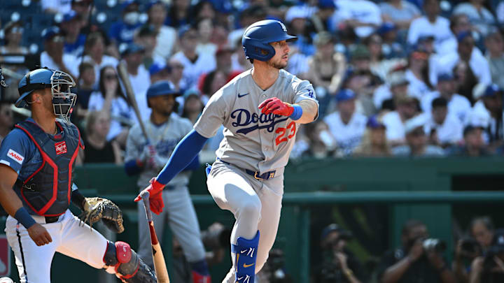 Apr 4, 2026; Washington, District of Columbia, USA; Los Angeles Dodgers right fielder Kyle Tucker (23) singles against the Washington Nationals during the first inning at Nationals Park. Mandatory Credit: Brad Mills-Imagn Images