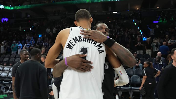 May 15, 2026; Minneapolis, Minnesota, USA; San Antonio Spurs forward Victor Wembanyama (1) talks with Minnesota Timberwolves center Naz Reid (11) after game six of the second round of the 2026 NBA Playoffs at Target Center. Mandatory Credit: Jesse Johnson-Imagn Images