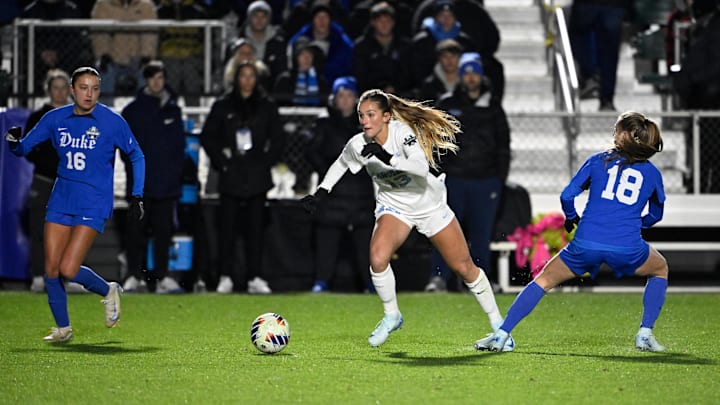 Dec 6, 2024; Cary, NC, USA; North Carolina fm Kate Faasse (13) with the ball as Duke midfielder Hannah Bebar (18) and midfielder Carina Lageyre (16) defend in the first half at WakeMed Soccer Park. Mandatory Credit: Bob Donnan-Imagn Images