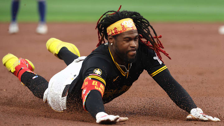 Pittsburgh Pirates center fielder Oneil Cruz (15) slides into third base on an RBI triple against the Chicago Cubs during the first inning at PNC Park. 