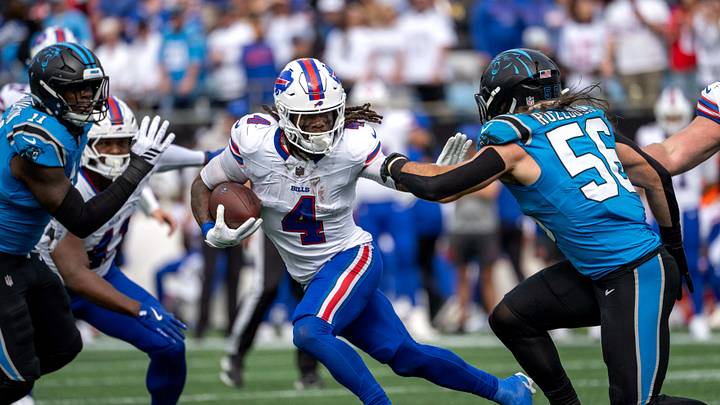 Buffalo Bills running back James Cook III (4) with the ball as Carolina Panthers linebacker Nic Scourton Buffalo Bills running back James Cook III (4) with the ball as Carolina Panthers linebacker Nic Scourton