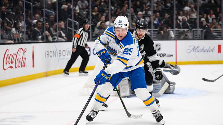 Apr 1, 2026; Los Angeles, California, USA; St. Louis Blues right wing Jordan Kyrou (25) controls the puck while under pressure from Los Angeles Kings right wing Adrian Kempe (9) during the first period at Crypto.com Arena. Mandatory Credit: William Liang-Imagn Images