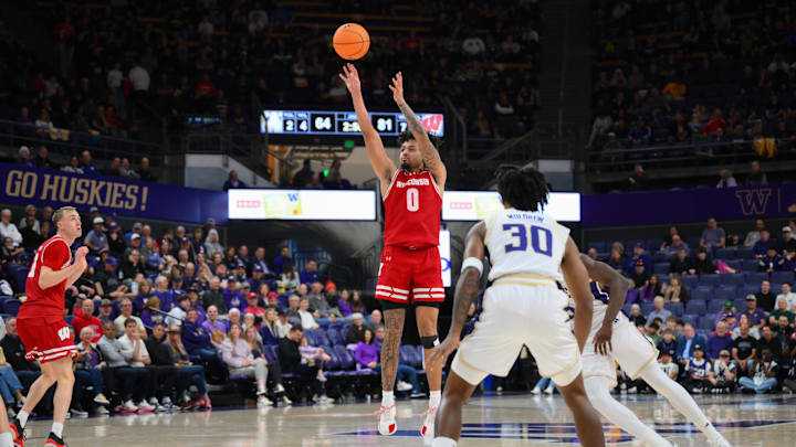 Feb 28, 2026; Seattle, Washington, USA; Wisconsin Badgers guard Braeden Carrington (0) shoots a three point shot against the Washington Huskies during the second half at Alaska Airlines Arena at Hec Edmundson Pavilion. 
