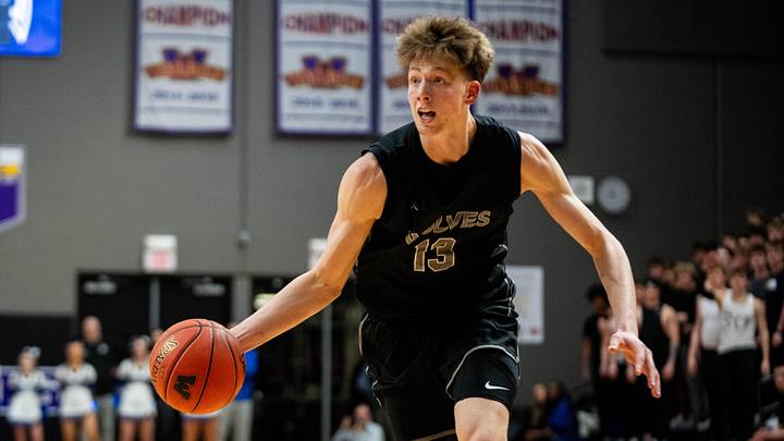 Northwest’s Landon Davis (13) drives down the court to the basket against Waukee on Feb. 3, 2026, at Waukee High School.