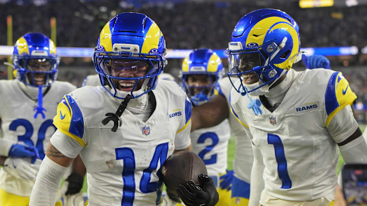 Nov 23, 2025; Inglewood, California, USA; Los Angeles Rams cornerback Cobie Durant (14) celebrates with cornerback Emmanuel Forbes Jr. (1) after returning an interception for a touchdown against the Tampa Bay Buccaneers during the first quarter at SoFi Stadium. Mandatory Credit: Kiyoshi Mio-Imagn Images