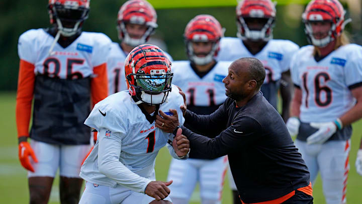Cincinnati Bengals wide receiver Ja'Marr Chase (1) runs through a drill with wide receivers coach