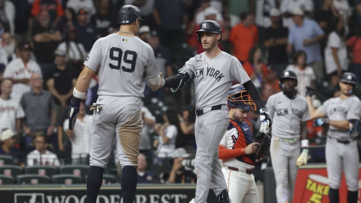 Sep 3, 2025; Houston, Texas, USA; New York Yankees right fielder Cody Bellinger (35) celebrates with designated hitter Aaron Judge (99) after hitting a three-run home run during the ninth inning against the Houston Astros at Daikin Park. Mandatory Credit: Troy Taormina-Imagn Images