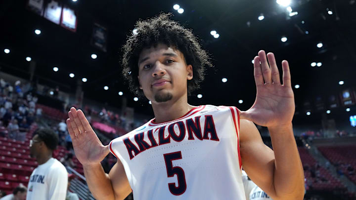 Mar 22, 2026; San Diego, CA, USA; Arizona Wildcats guard Brayden Burries (5) celebrates after defeating the Utah State Aggies during a second round game of the men's 2026 NCAA Tournament at Viejas Arena. Mandatory Credit: Kirby Lee-Imagn Images