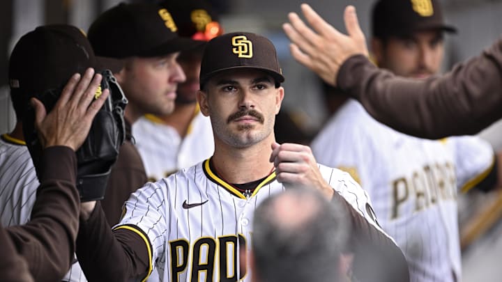 Sep 18, 2024; San Diego, California, USA; San Diego Padres starting pitcher Dylan Cease (84) is congratulated in the dugout after a pitching change in the ninth inning against the Houston Astros at Petco Park. Mandatory Credit: Orlando Ramirez-Imagn Images