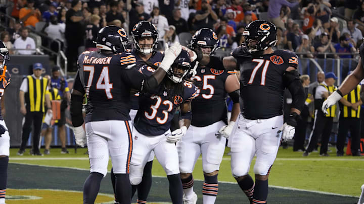 Aug 17, 2025; Chicago, Illinois, USA; Chicago Bears running back Ian Wheeler (33) celebrates his touchdown against the Buffalo Bills with guard Jordan McFadden (74) during the first half at Soldier Field. Mandatory Credit: David Banks-Imagn Images