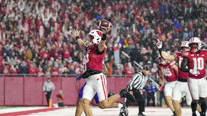 Nov 8, 2025; Madison, Wisconsin, USA;  Wisconsin Badgers quarterback Carter Smith (5) celebrates after rushing for a touchdown during the third quarter against the Washington Huskies at Camp Randall Stadium. Mandatory Credit: Jeff Hanisch-Imagn Images