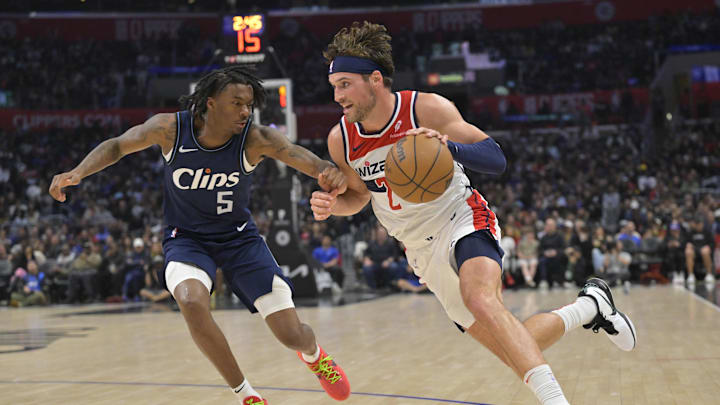 Mar 1, 2024; Los Angeles, California, USA;   Los Angeles Clippers guard Bones Hyland (5) defends Washington Wizards forward Corey Kispert (24) in the second half at Crypto.com Arena. Mandatory Credit: Jayne Kamin-Oncea-Imagn Images
